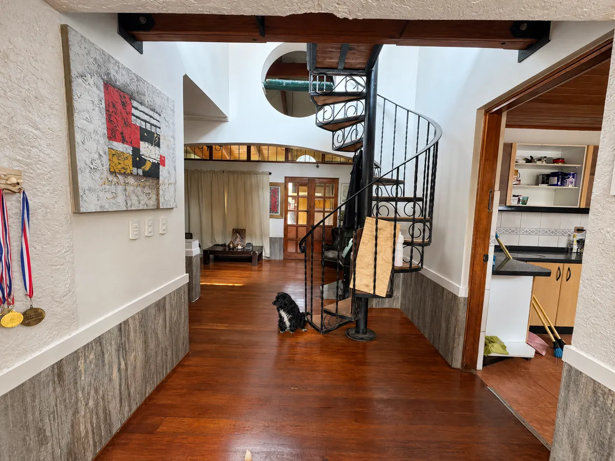 Inside hallway of the house with a spiral staircase